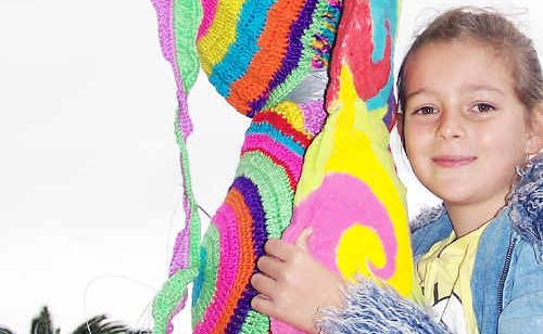 Nine-year-old Tylah Bauer with her colourfully-dressed tree ready for the Jumpers and Jazz Festival. Nine-year-old Tylah Bauer with her colourfully-dressed tree ready for the Jumpers and Jazz Festival.